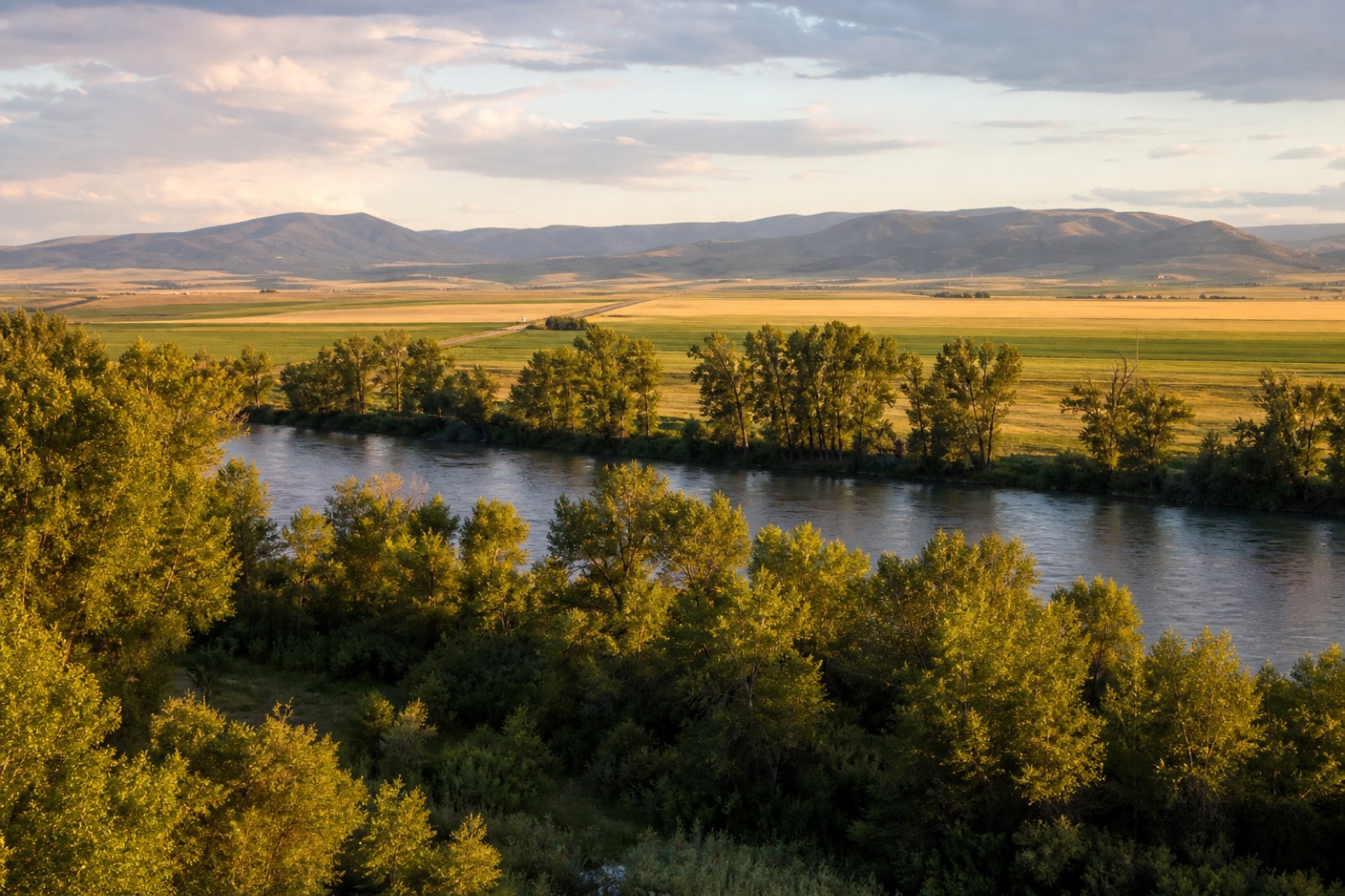 River and fields near Manhattan, Montana beneath an open sky